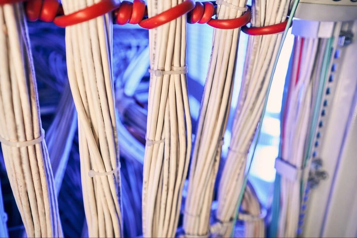 Vertical Cable Management in a Data Centre Vertical cable management with bundled cables routed through a data centre rack